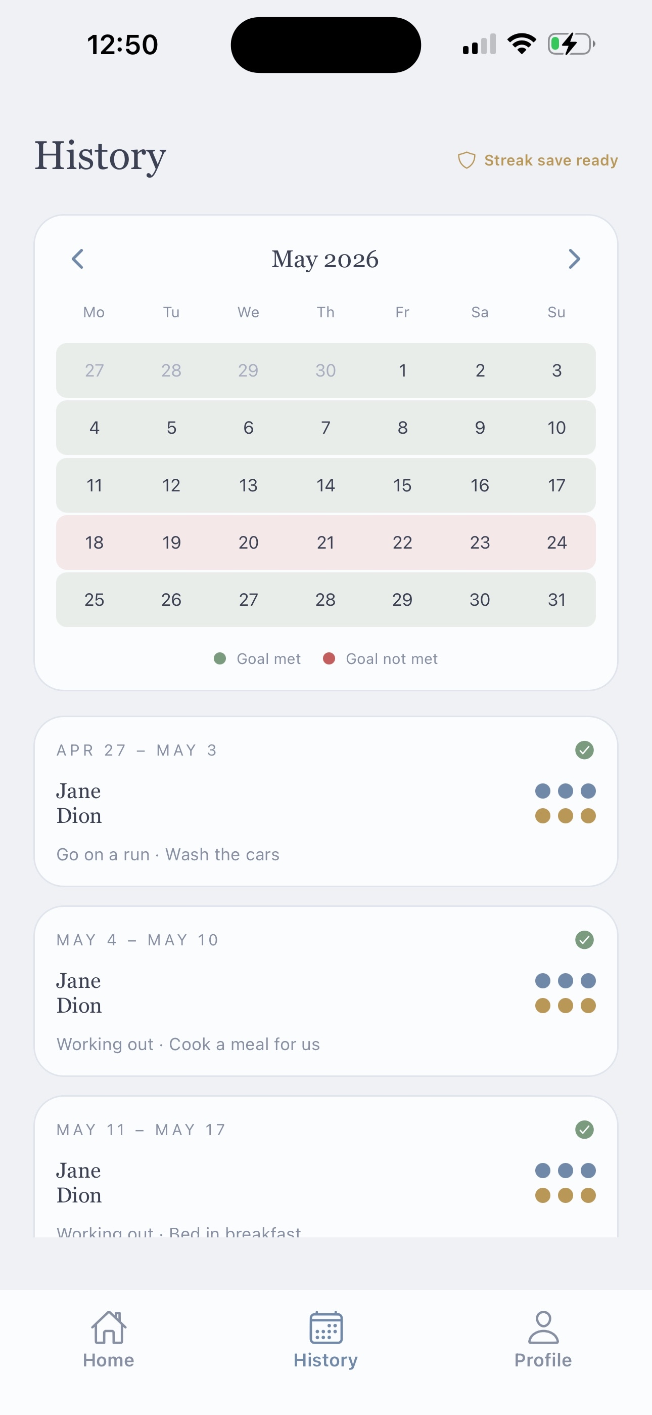History screen with a monthly calendar of goals met and weekly summaries